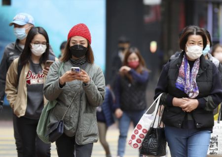 (miniature) Des habitants portant des masques à Hong Kong