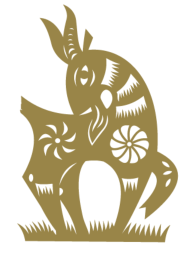 Gold paper-cut of a goat on a black ground, looking back over its shoulder.