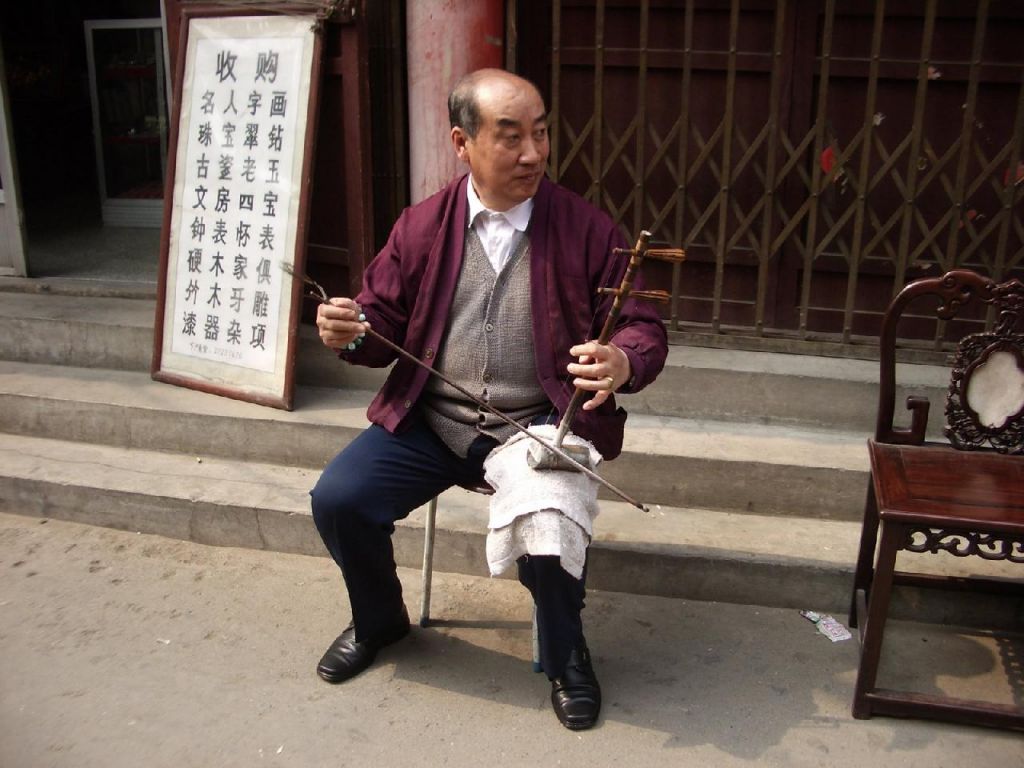 Joueur de Jinghu dans la Rue
