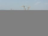 Le dernier élément en acier du tablier est hissé sur le chantier de construction du grand pont de Jiaojiang