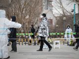 Des habitants font la queue pour les tests d'acide nucléique dans l'arrondissement de Yuhong