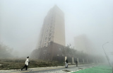 Photos Chine : un pais brouillard enveloppe Pkin